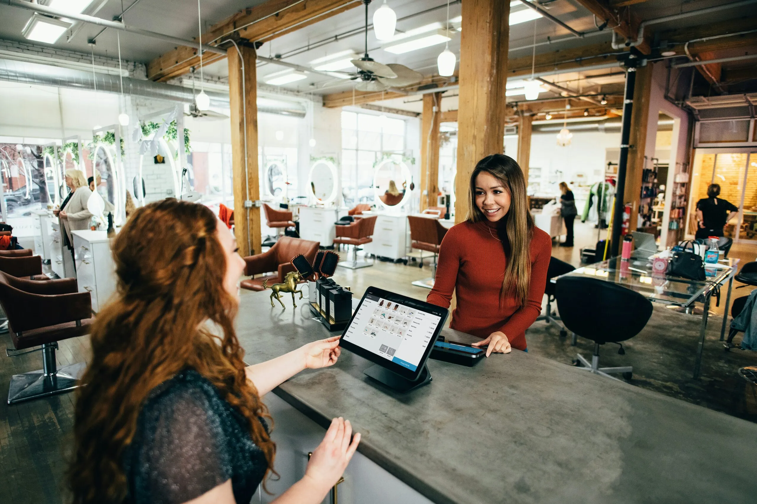 An employee uses software to check customer prices, quotes and sales agreements.